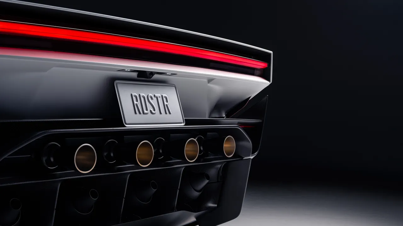 Rear of the next-generation Tesla Roadster: full-width red light bar, RDSTR plate and a row of cold-gas thruster nozzles