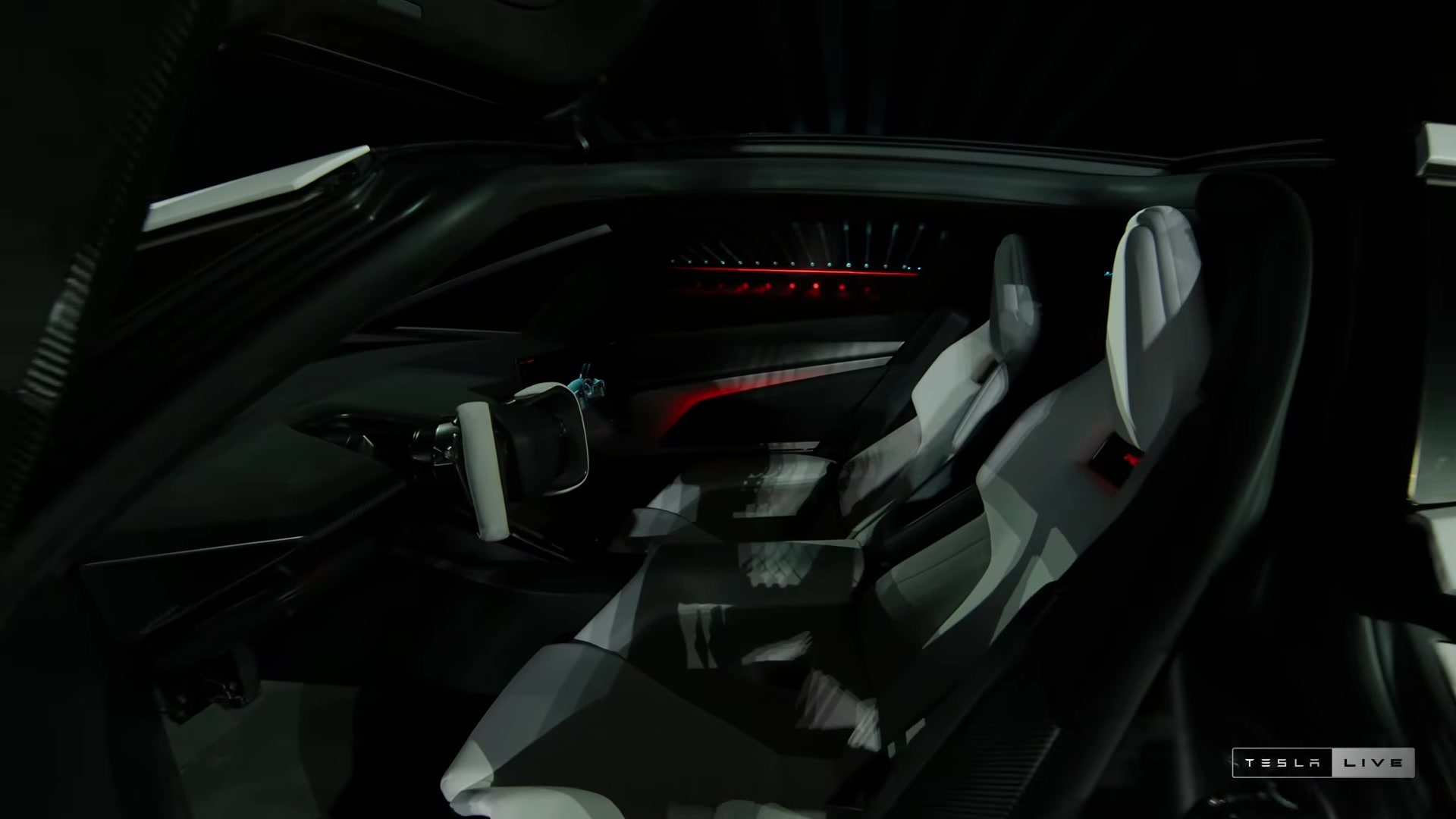 Roadster cockpit with white seats, yoke and screens