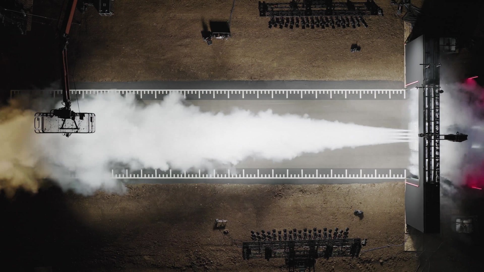 Overhead view of a thruster test firing a long white plume of gas