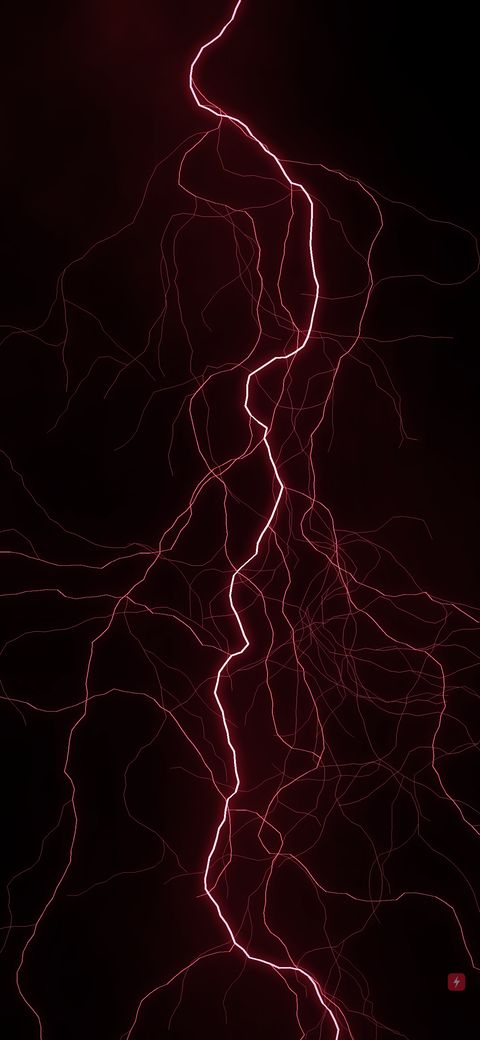 Branching red lightning through a dark sky.